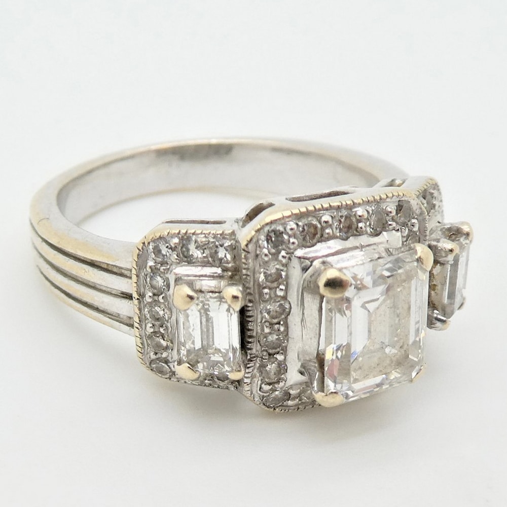 Triple cluster diamond engagement ring re-model