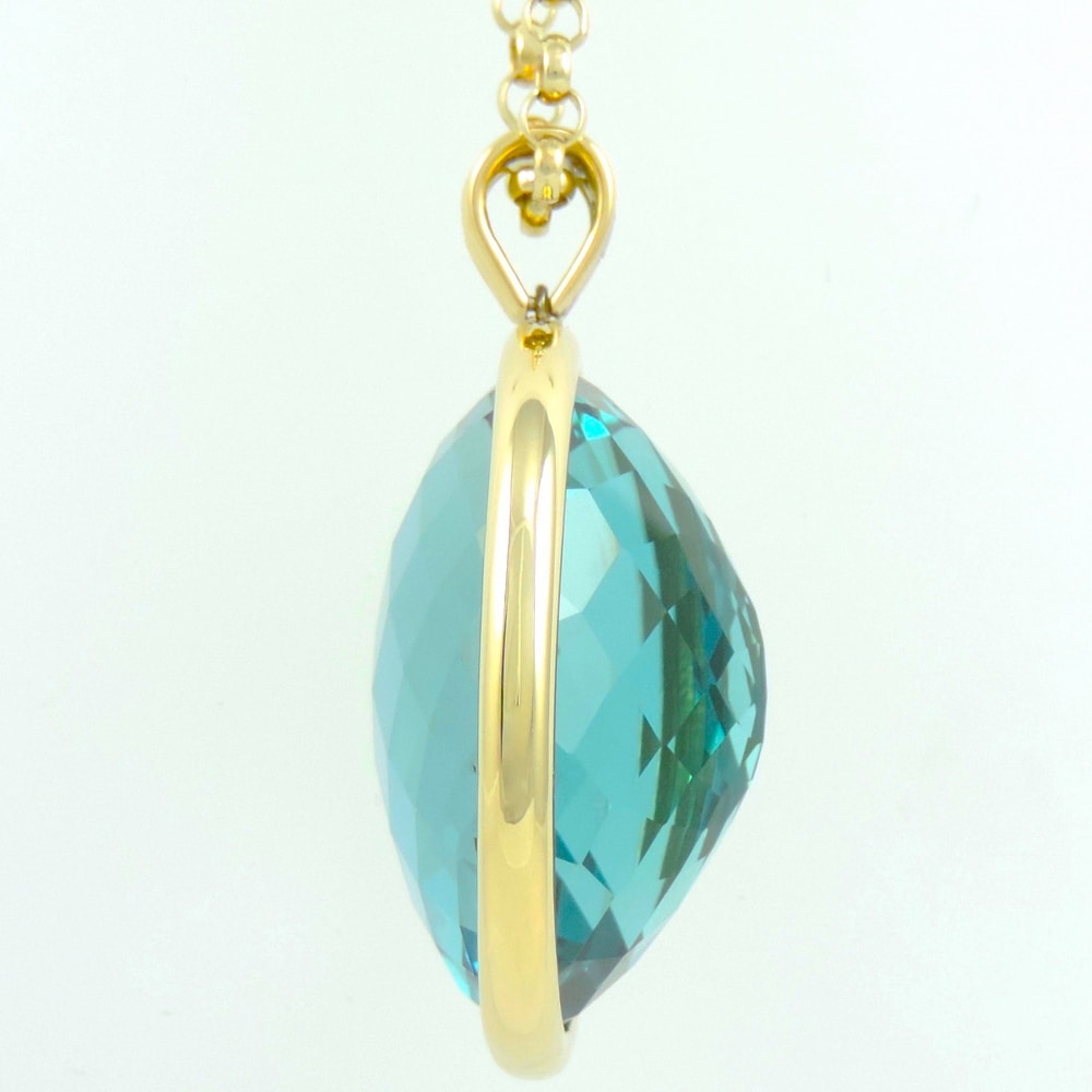 Blue topaz spectacle set pendant