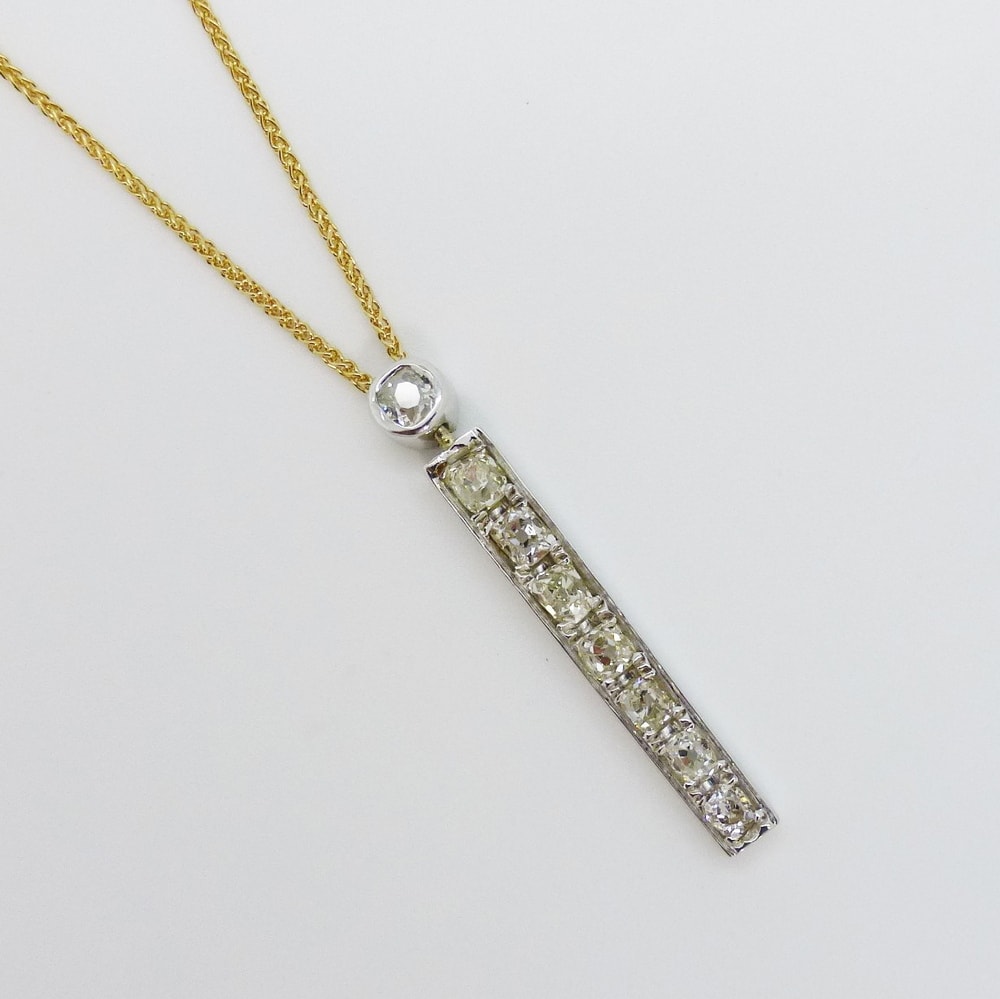 Diamond drop pendant channel set