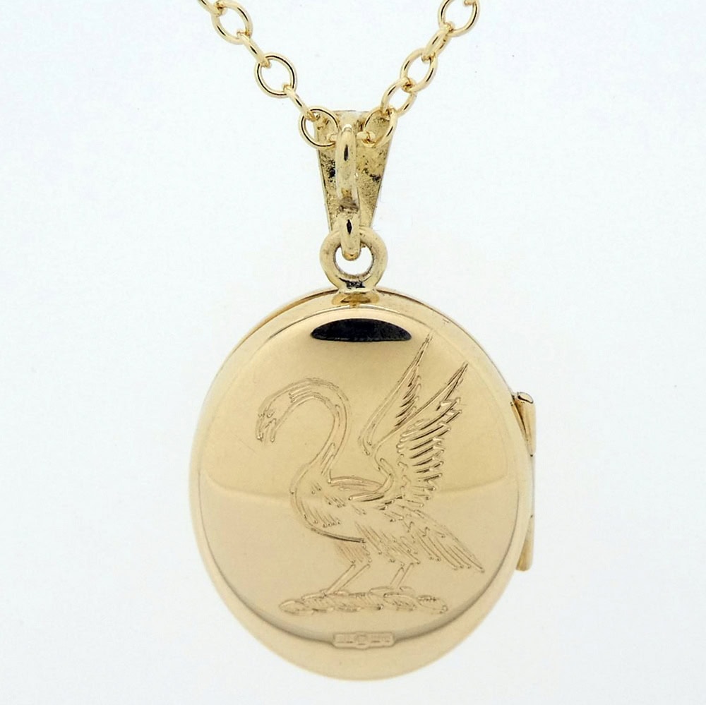 Gold locket family crest engraved
