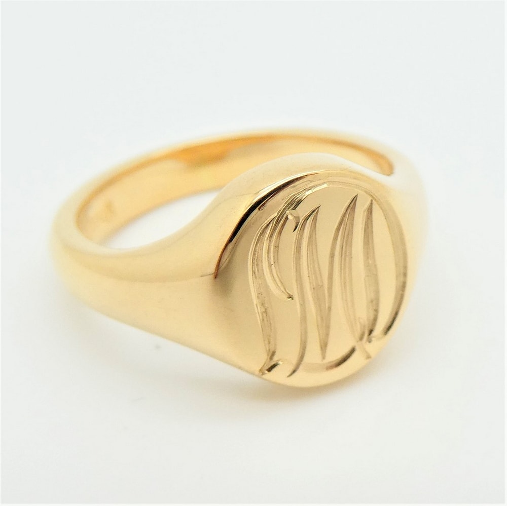 Gold signet ring engraved with initials