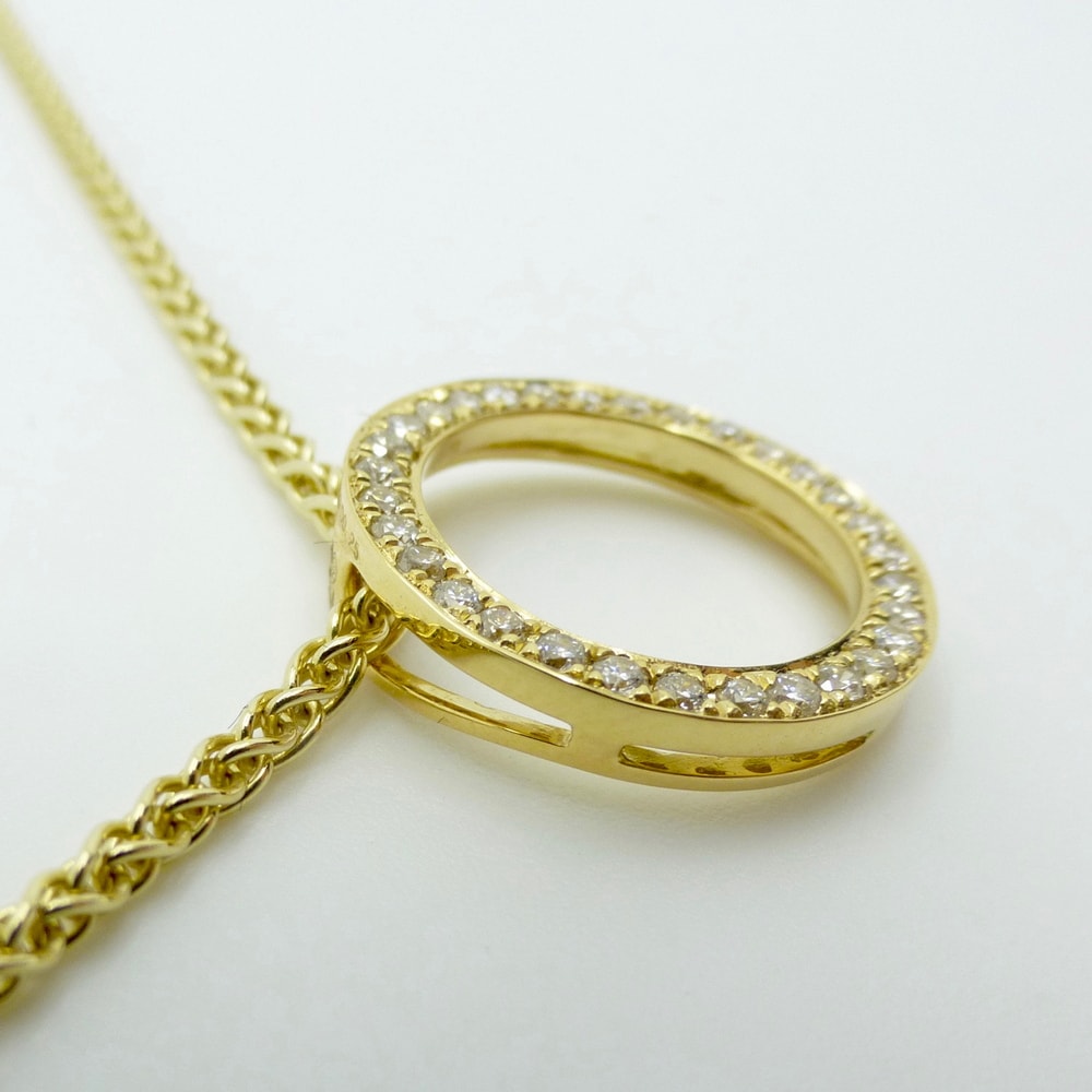 Diamond hollow circle pendant in yellow gold