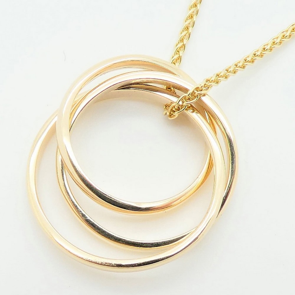 Gold triple ring pendant
