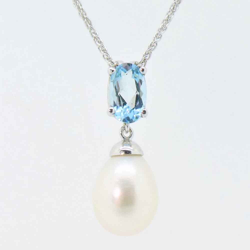 Aquamarine and pearl drop pendant in white gold