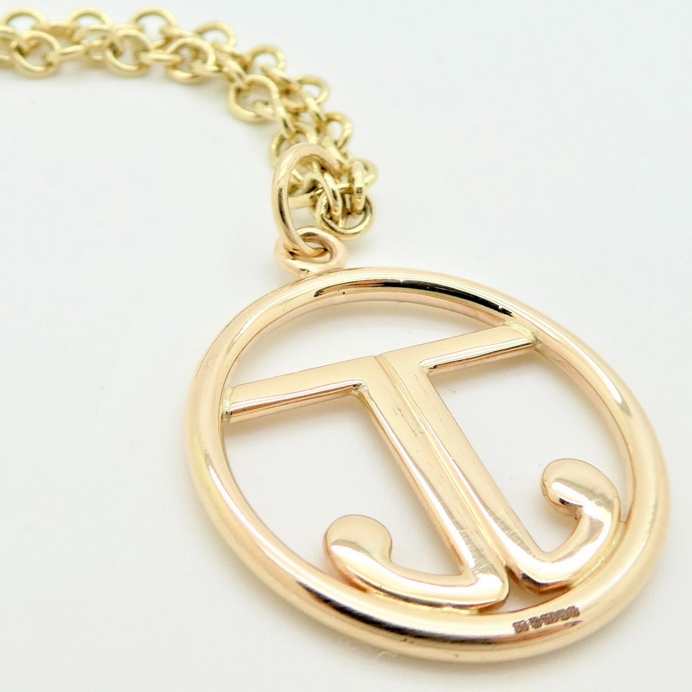 Gold pendant with initials