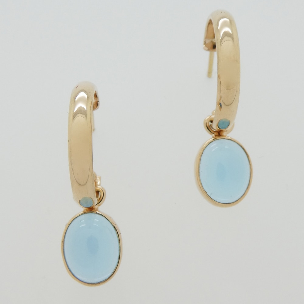 Gold hoop earrings with cabochon aquamarine drops
