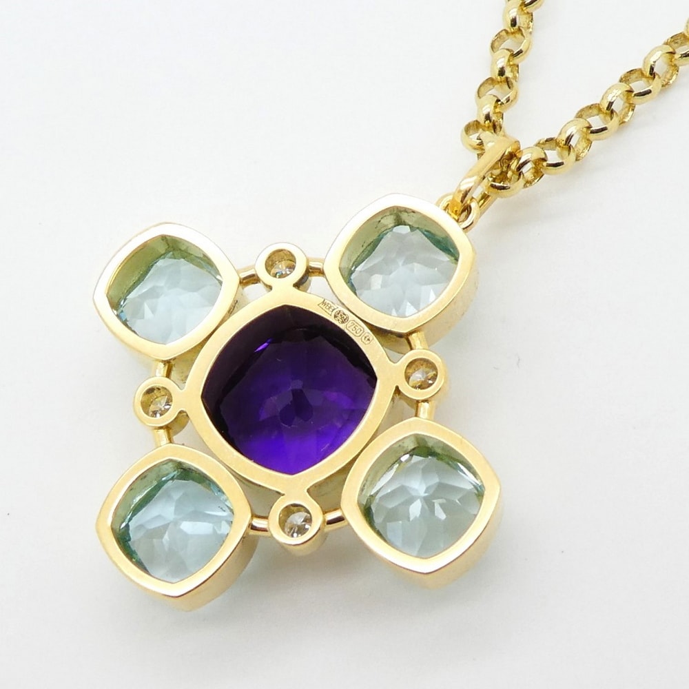 Reverse amethyst and blue topaz pendant