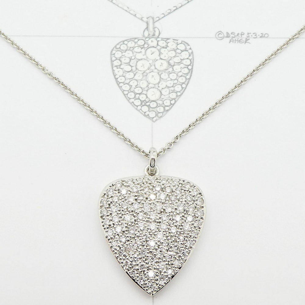 Pave diamond heart pendant in platinum