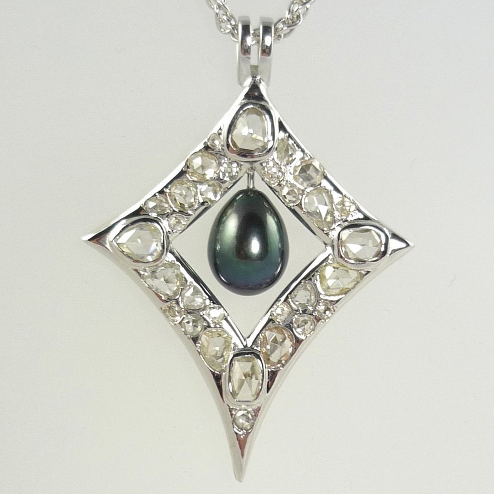 Black pearl and diamond old cut pendant in white gold