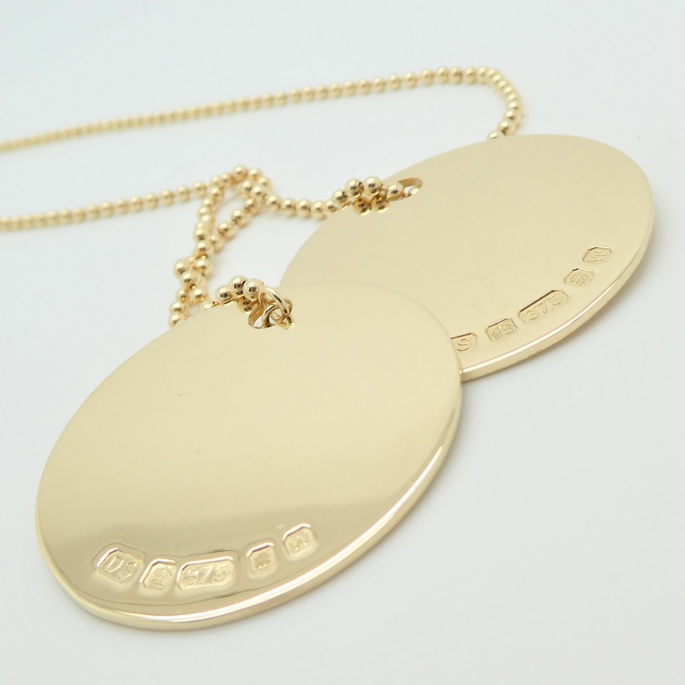 Gold military identity tags dog tags