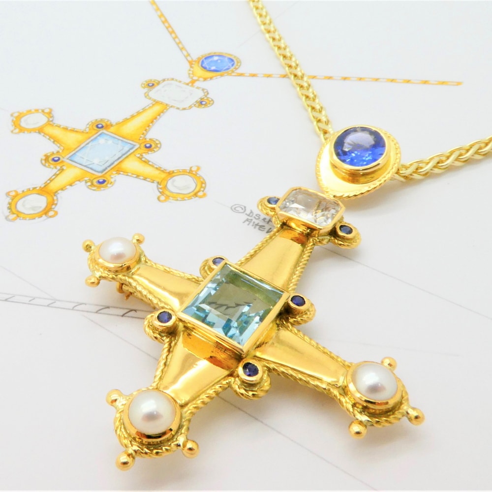 Gothic cross pendant set with sapphire aquamarine and pearls all in 18 carat yellow gold