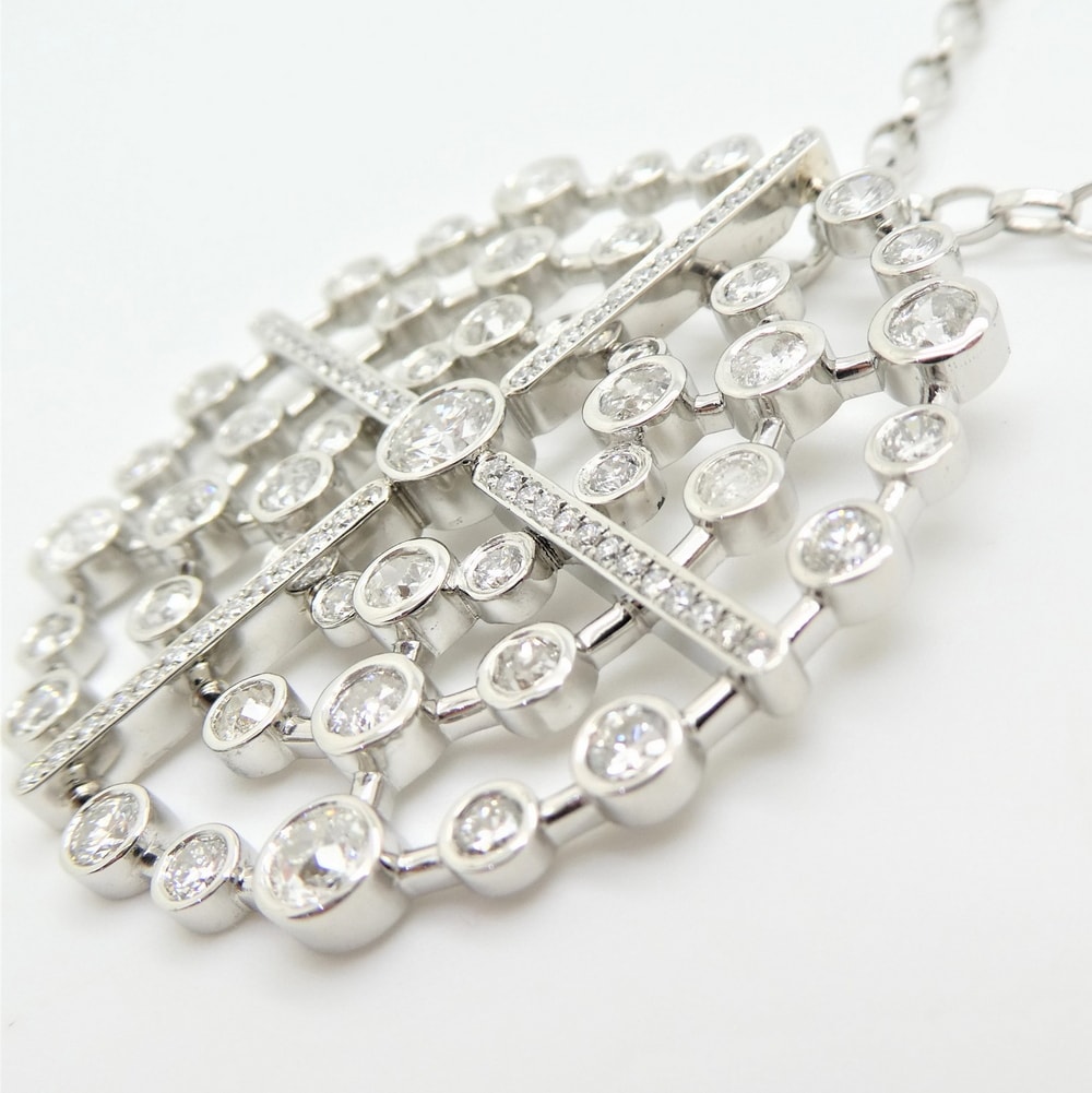 Diamond concentric circle pendant in platinum
