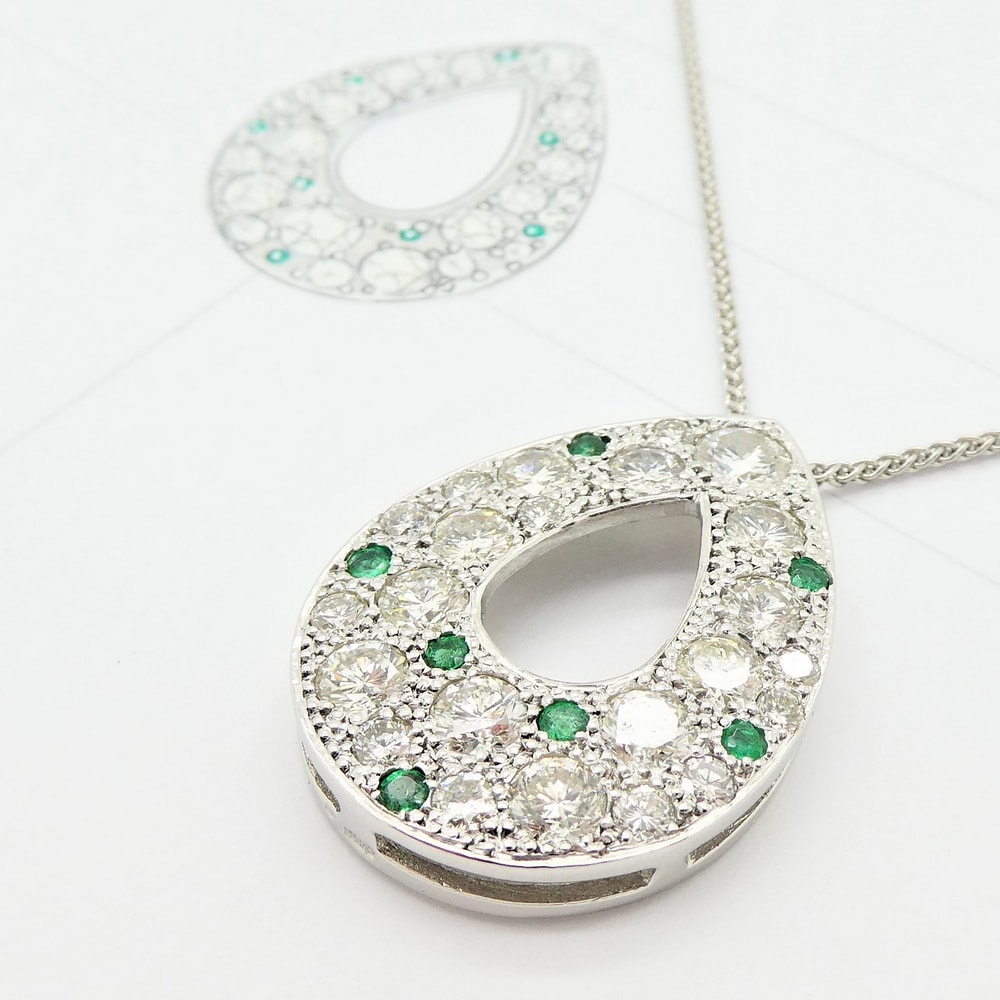 Diamond and emerald pendant in white gold