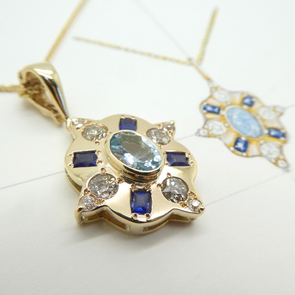 Aquamarine sapphire and diamond pendant in yellow gold