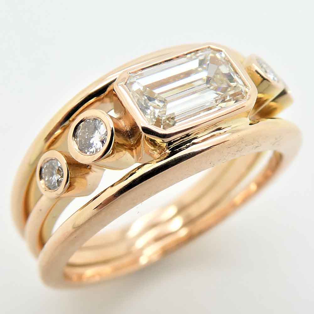 Emerald cut diamond rose gold dress ring