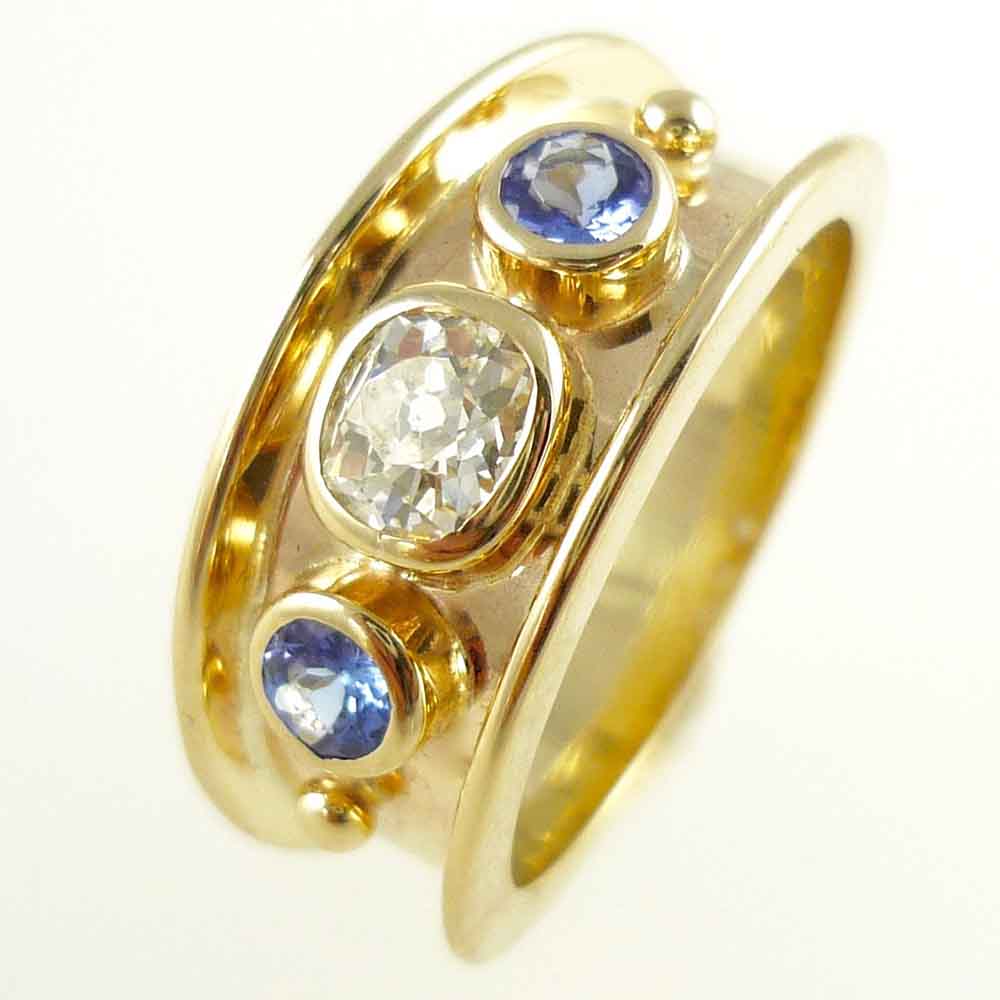 Diamond & tanzanite romanesque dress ring yellow gold