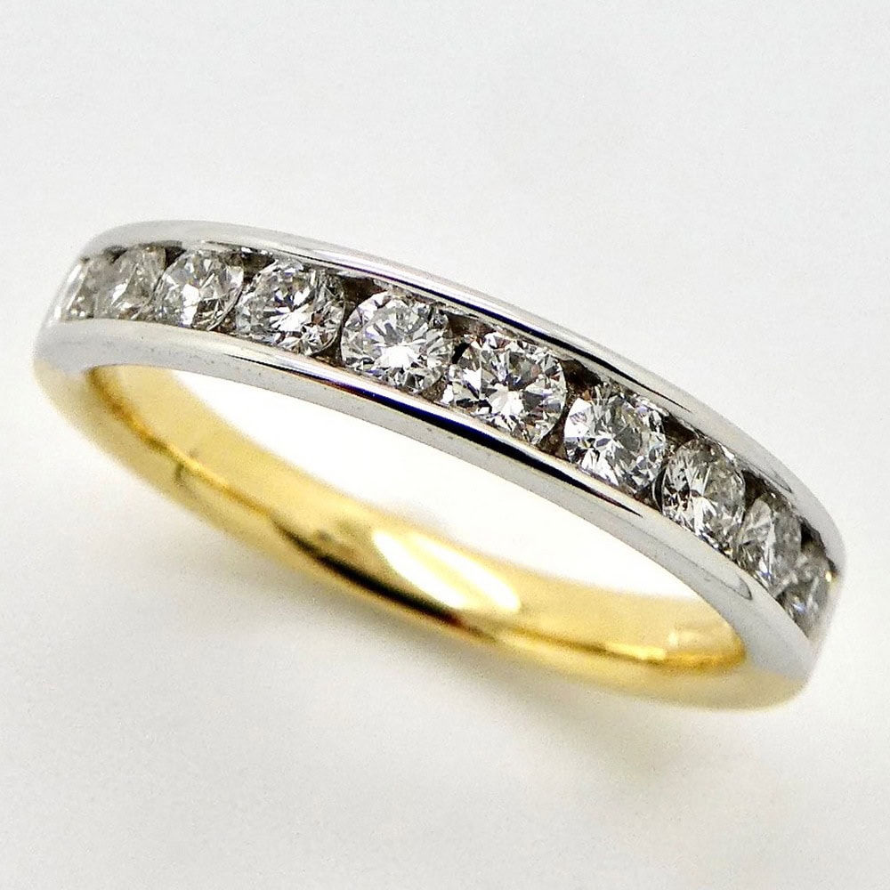 Channel round diamond set eternity ring in platinum & yellow gold