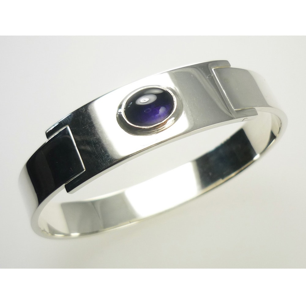 Bespoke silver bangle set with cabochon sapphire