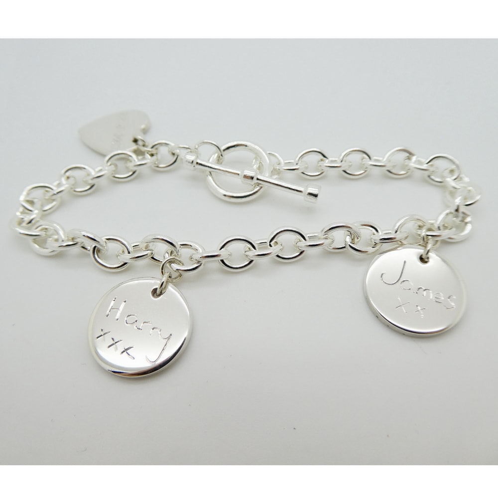 Silver bracelet with facsimile engraved silver charms