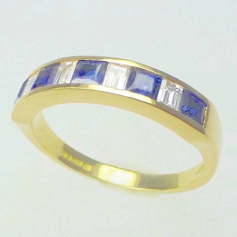 Sapphire & diamond channel set eternity ring