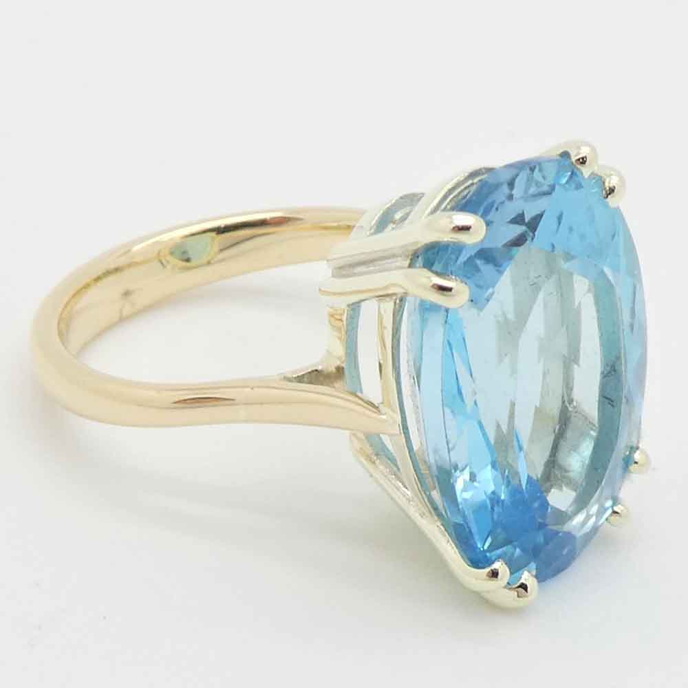 Blue topaz oval cut dress ring white gold