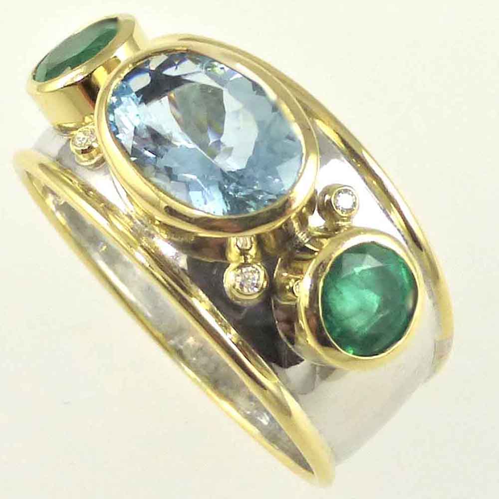 Aquamarine & emerald white & yellow gold bombe dress ring