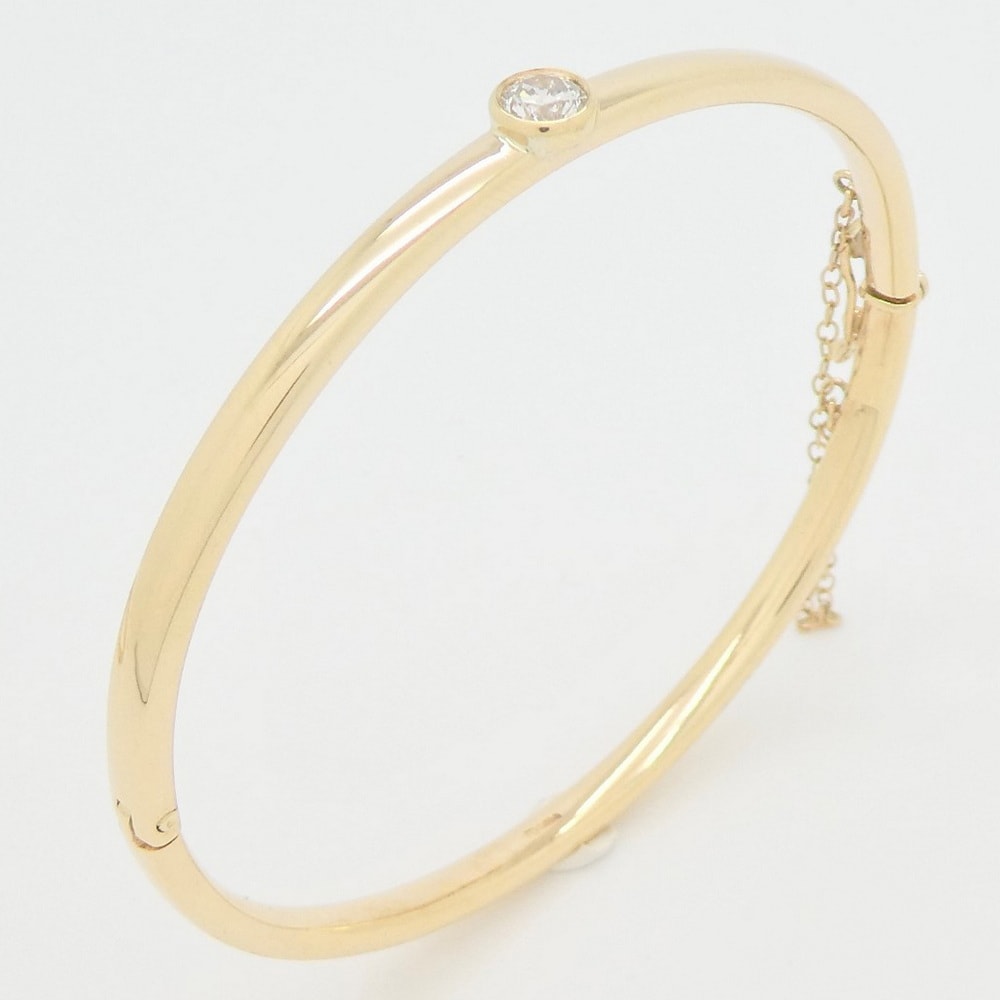 Diamond set yellow gold bangle