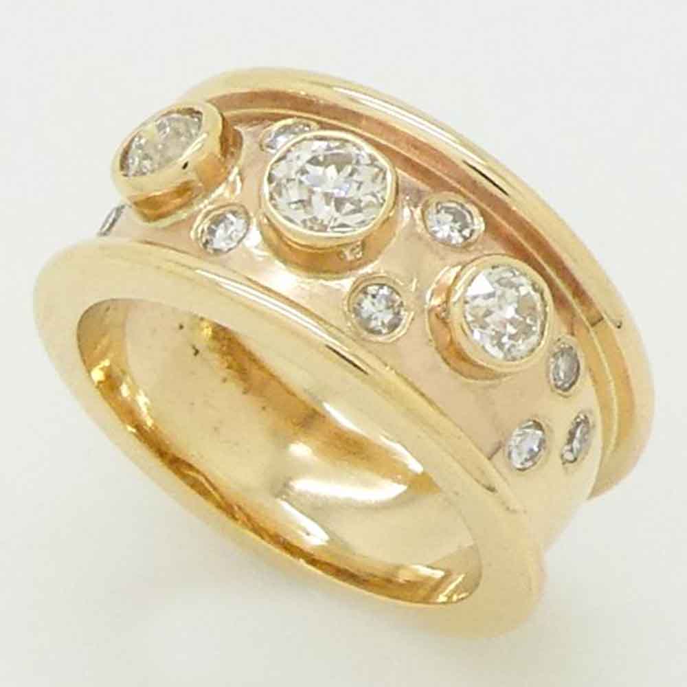 Romanesque diamond set bombe ring yellow gold