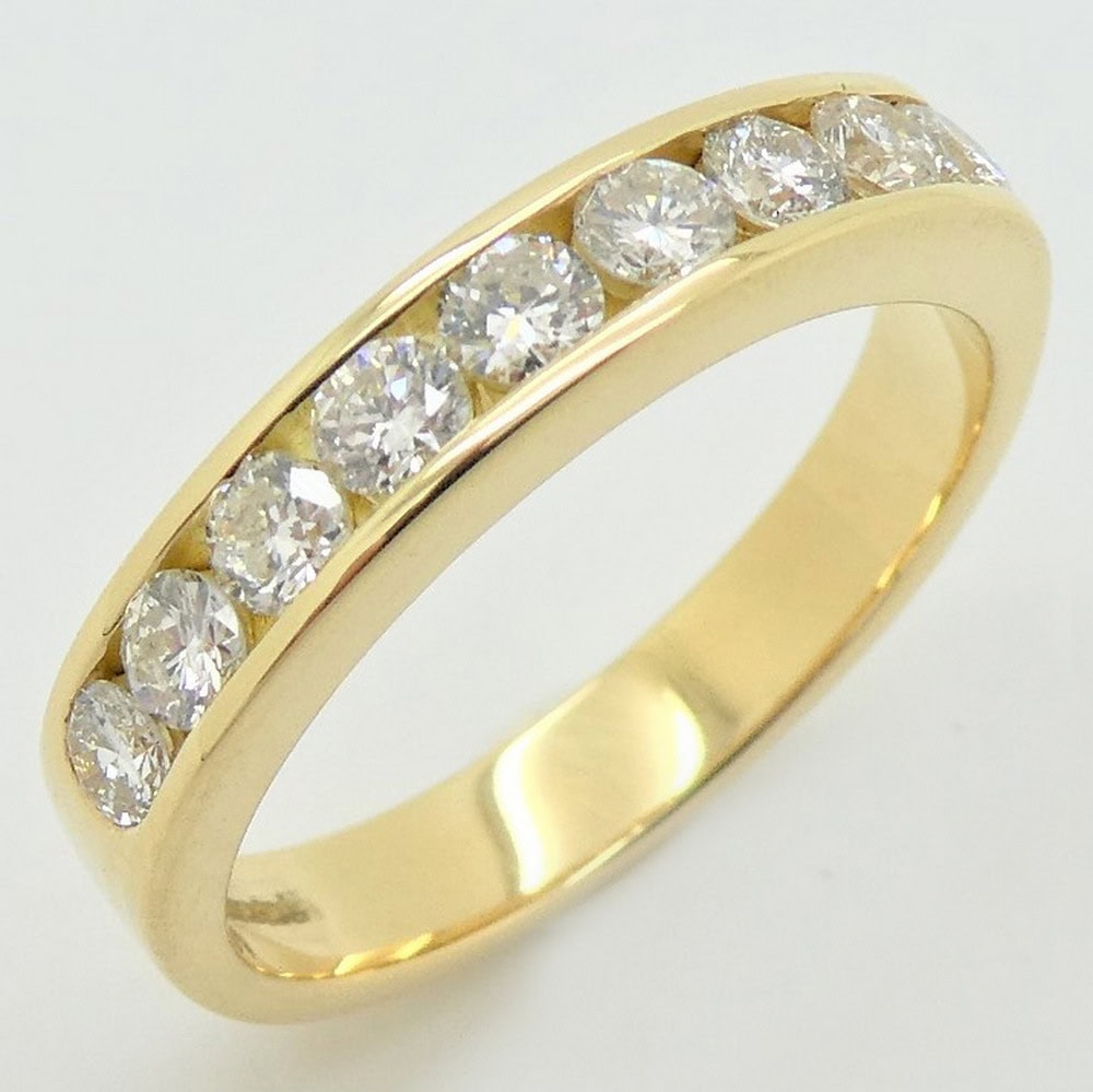 Diamond channel set half eternity ring yellow gold