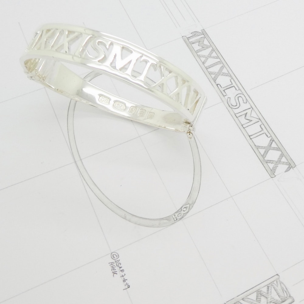 Silver bangle with pierced out date & initials