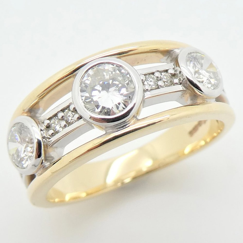 3 stone diamond ring in platinum and yellow gold