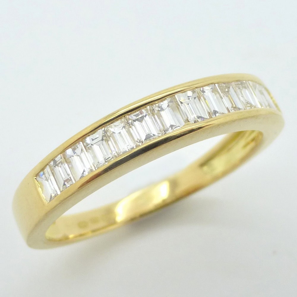 Diamond baguette channel set half eternity ring yellow gold