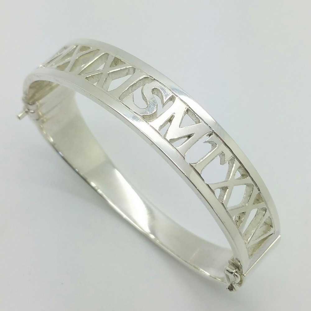 Bespoke silver bangle with pierced initials