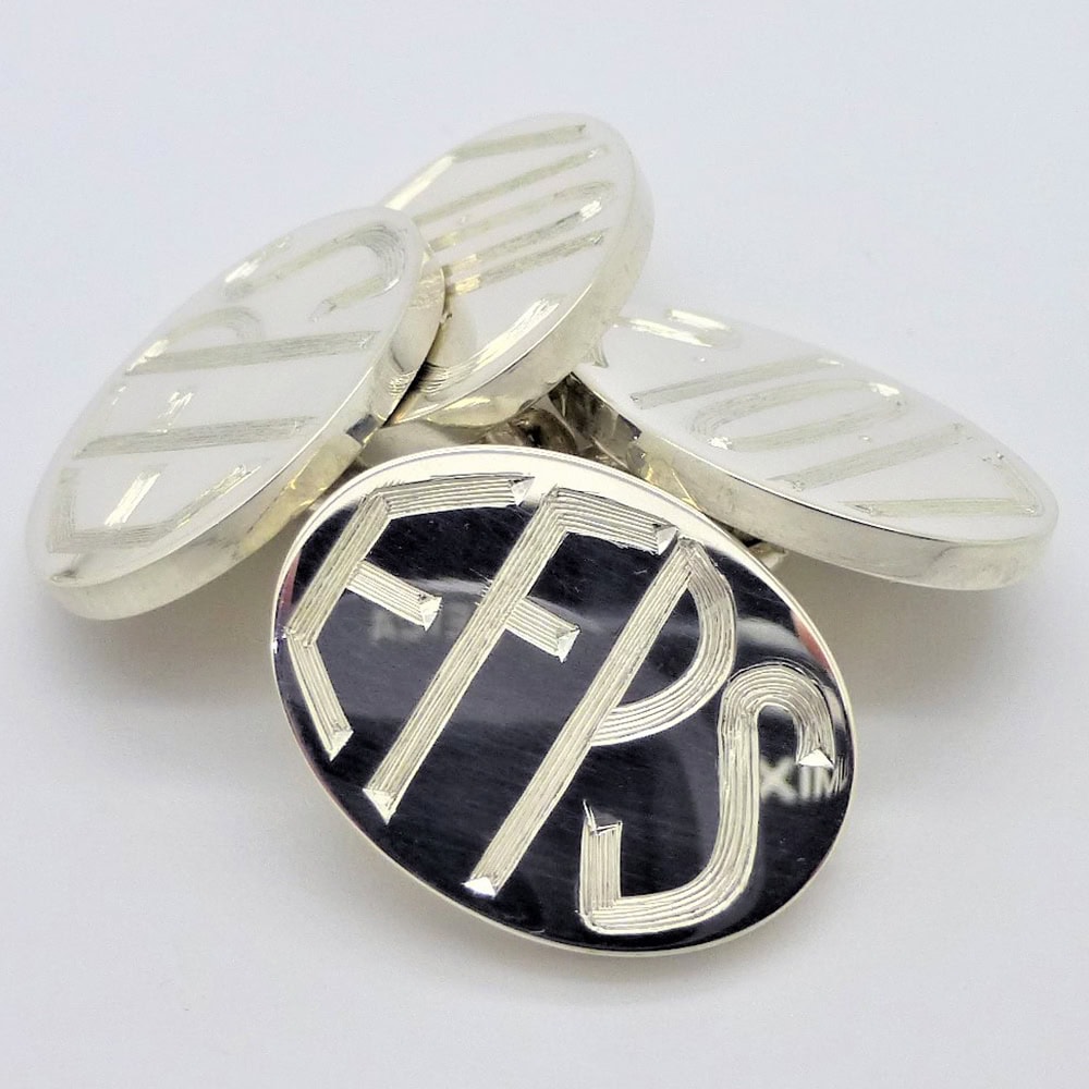 Bespoke hand engraved silver cufflinks using a contemporary font style