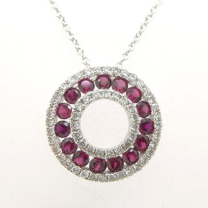 Ruby and diamond hollow circle pendant set in 18 carat white gold